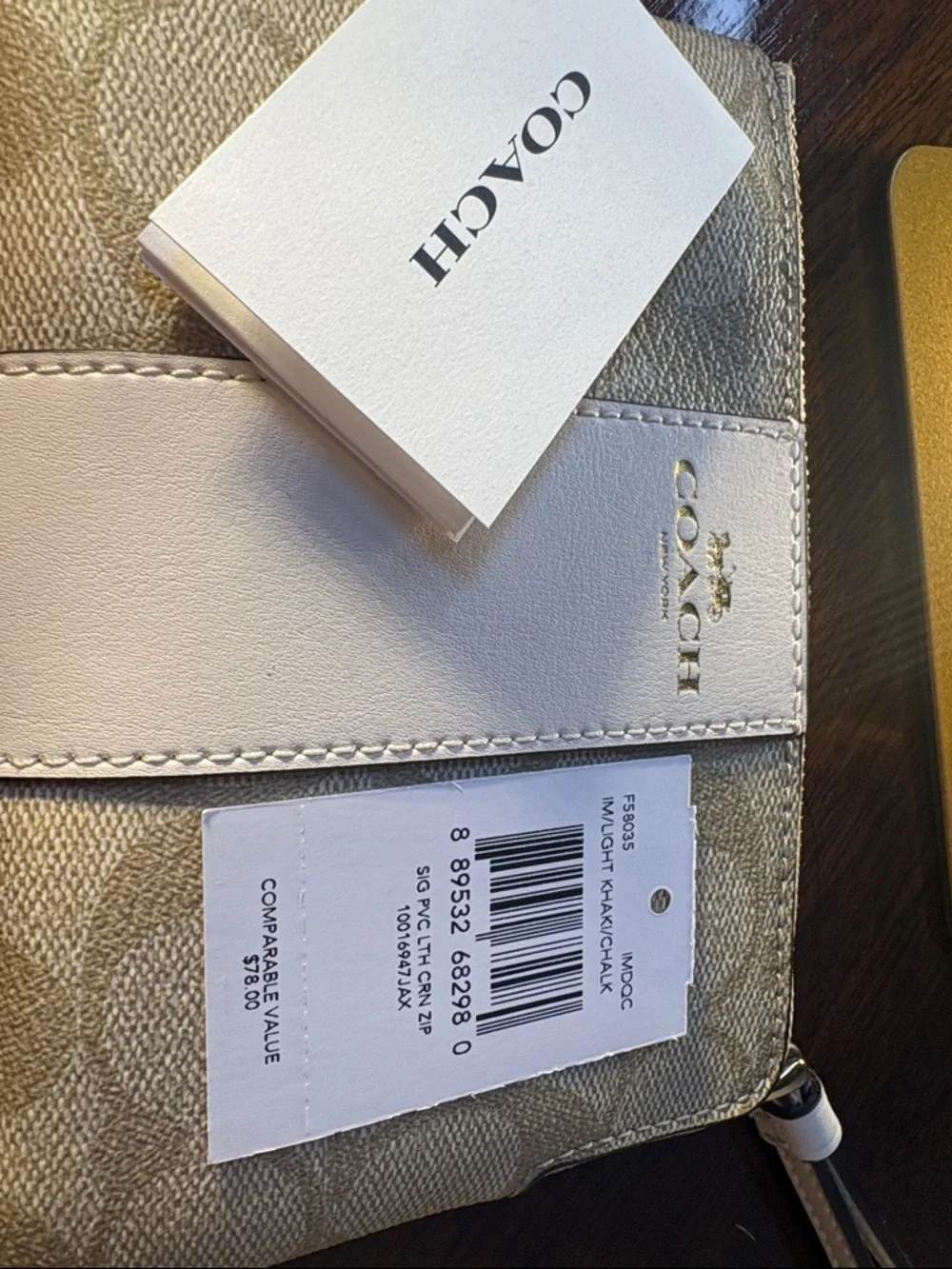 Coach Beige & White Signature Wristlet with Gold Logo